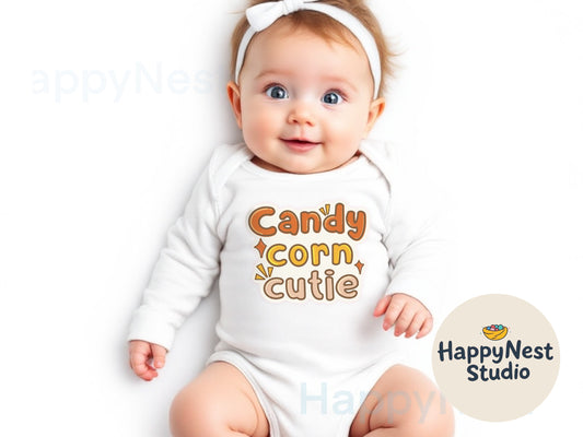 white long sleeve baby bodysuit with text “candy corn cutie” written in orange color, yellow and off white with contrast color outline to it. it is in Halloween theme designed for babies who are going to experience their first trick or treat.
unique Halloween onesie gift for baby shower
