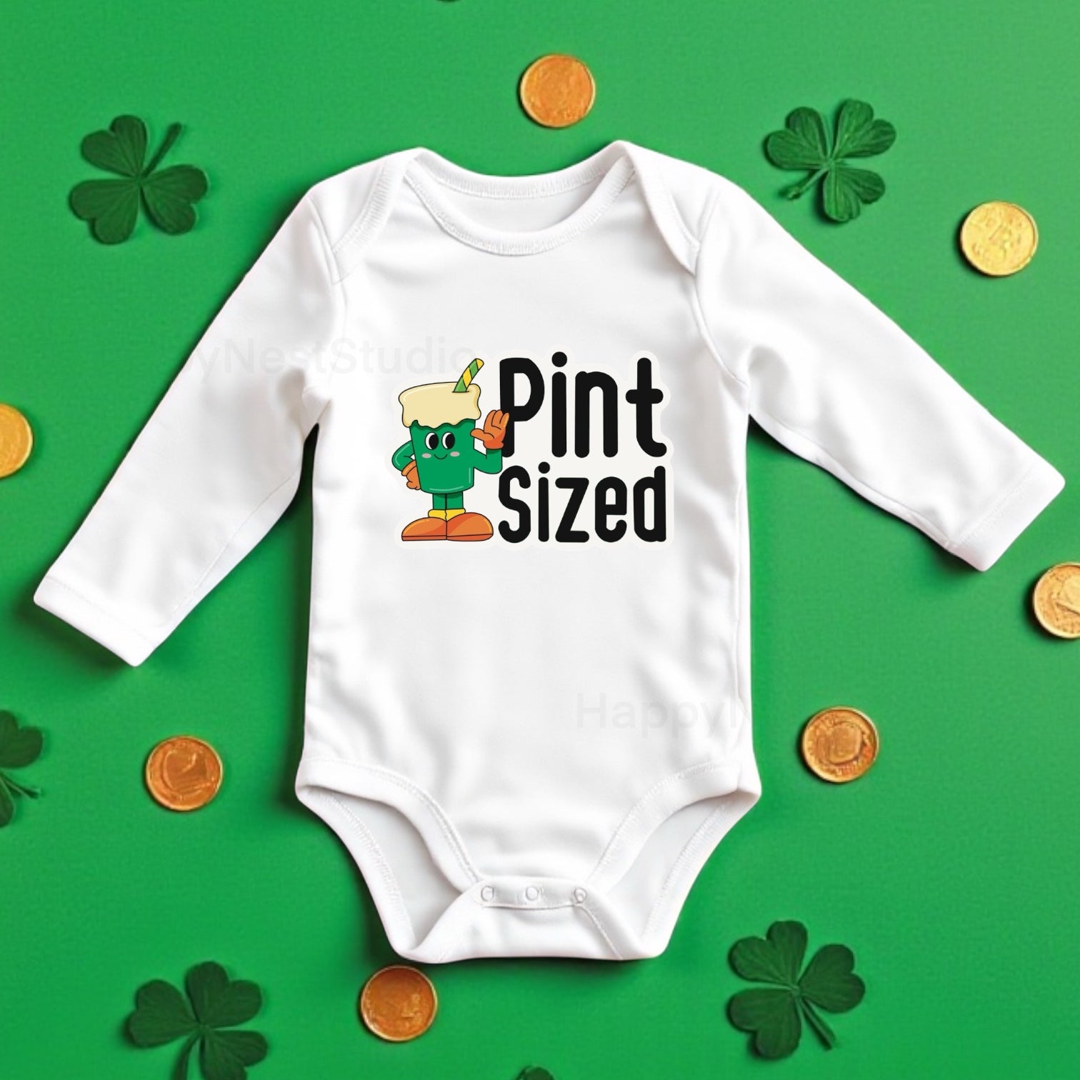 White long-sleeve baby onesie featuring a unique, shop-owner–designed sublimated printable-vinyl graphic that reads ‘Pint Sized’ in bold black lettering, paired with a groovy-style green drink glass illustration with a straw. This handmade Saint Patrick’s Day baby bodysuit makes a perfect Irish-themed onesie gift, newborn baby outfit, or cute everyday wear babies. Ideal for parents searching for green baby clothing, shamrock newborn outfits, sublimation onesies, funny, cute Irish baby gift ideas